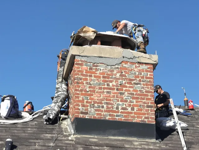 Shaker Heights Chimney Sweep installing a custom chimney crown in Shaker Heights, OH