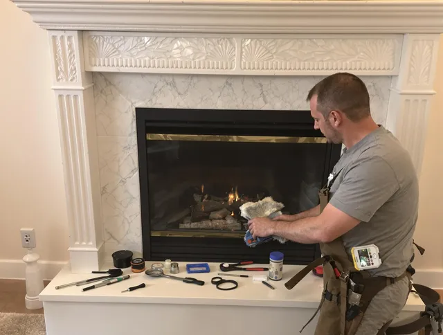 Shaker Heights Chimney Sweep performing fireplace maintenance in Shaker Heights, OH